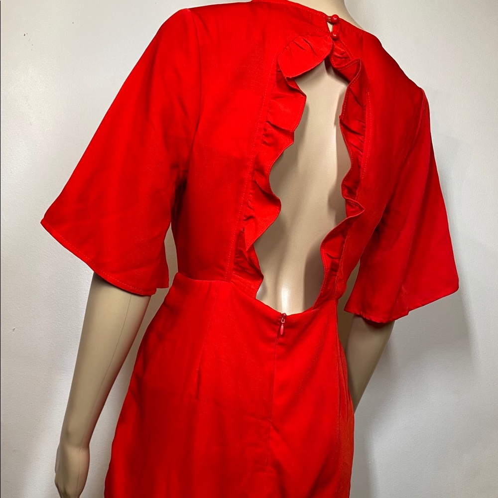 MISSGUIDED Red romper with low ruffled back.
